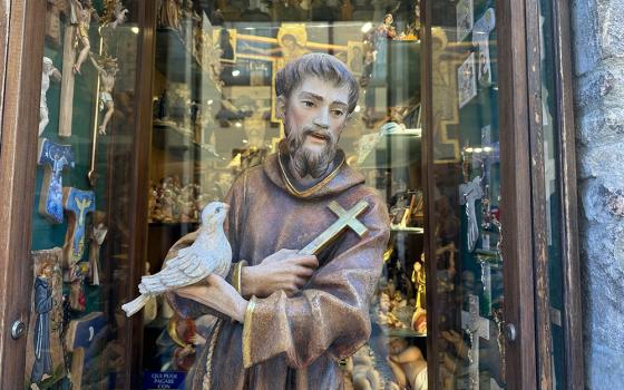 A statue of St. Francis is seen in a storefront along a street in Assisi, Italy, Feb. 22, 2026. (OSV News/Courtney Mares)