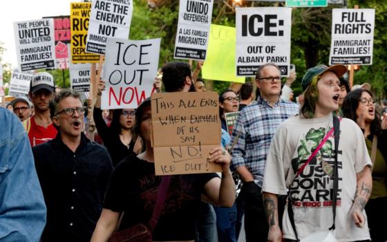 Demonstrators opposed to U.S. Immigration and Customs Enforcement, or ICE, march through the streets during a protest in the Albany Park neighborhood of Chicago June 3, 2026, against immigration enforcement operations by federal agents. (OSV News photo/Jim Vondruska, Reuters)