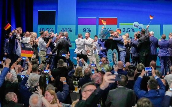 Alternative for Germany party members celebrate after the first results of the Saxony-Anhalt state elections in Magdeburg, eastern Germany, Sept. 6, 2026. (AP/Matthias Schrader)