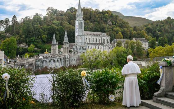 Pope Leo XIV looks at the Sanctuary of Our Lady of Lourdes from the hill of the Carmelite Monastery of Lourdes in France, Sept. 27, 2026, after a private meeting with contemplative religious sisters. Three days later, Leo met with a group of Dominican contemplatives at the Vatican. (CNS/Vatican Media)