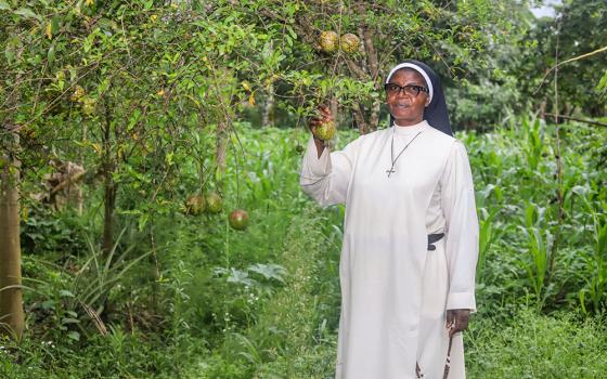 Sr. Fidelia Viban, mother general of the Dominican contemplative nuns at the Monastery of St. Dominic in Bambui, Cameroon, stands on the monastery farm. The sisters grow crops to support their community and help people in need, including families displaced by the Anglophone conflict. (GSR photo/Doreen Ajiambo)
