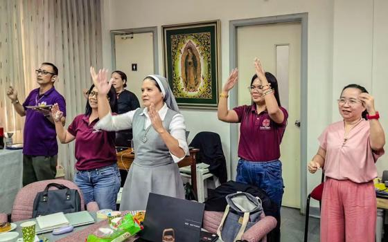 Sr. Ingkie Veloz Taboclaon leads a quick stretch and dance to keep the energy up during a Caritas Philippines workshop. (Facebook/Courtesy of Ingkie Veloz Taboclaon)