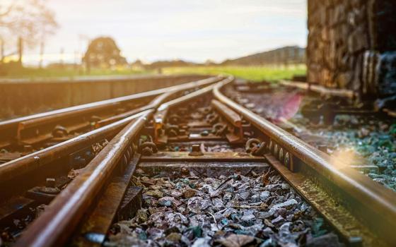 Train tracks converging (Unsplash/Matteo Massimi)