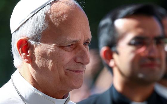 Pope Leo XIV smiles as he arrives at Rome's Gemelli Hospital Oct. 13, 2026, ahead of his surgery that afternoon to remove a lung nodule. (OSV News/Reuters/Guglielmo Mangiapane)