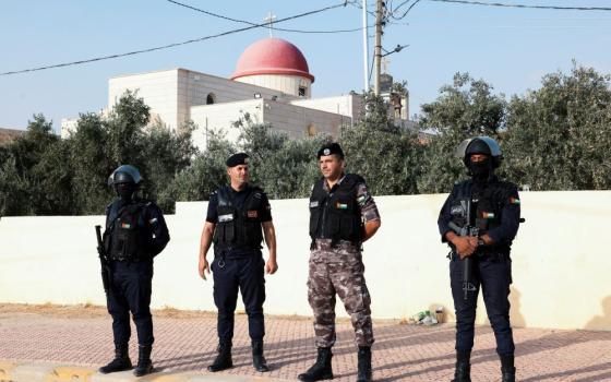 Security personnel stand outside St. George's Greek Orthodox Church, where gunmen opened fire during a funeral the previous day, in the village of Karak, Jordan, Oct. 24, 2026. (OSV News/Alaa Al Sukhni, Reuters)