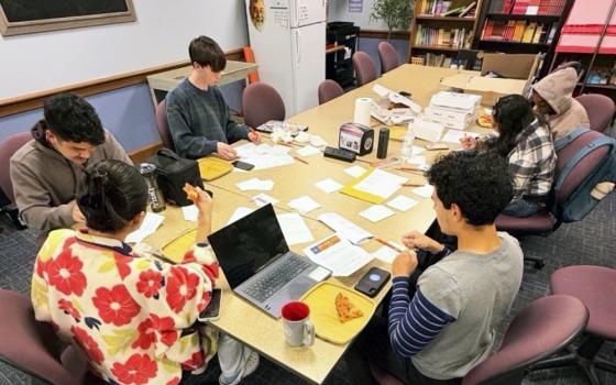 Students attend a postcard writing party hosted by St. Carol Coston fellows Chase Tuller and Anthony Miranda at John Carroll University in Cleveland, October 2026. (Courtesy of Chase Tuller and Anthony Miranda)