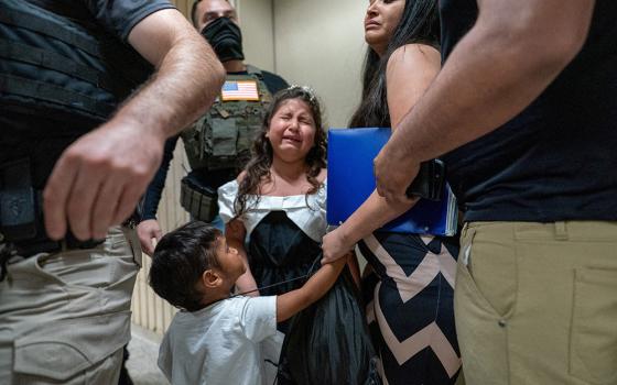 A child weeps as her father is detained by federal immigration officers at U.S. immigration court in the Manhattan borough of New York City July 25, 2025. (OSV News/Reuters/David 'Dee' Delgado)