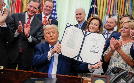U.S. President Donald Trump signs the Secure America Act, which provides another $70 billion for immigration enforcement, in the Oval Office at the White House in Washington June 10, 2026. (OSV News/Reuters/Evan Vucci)