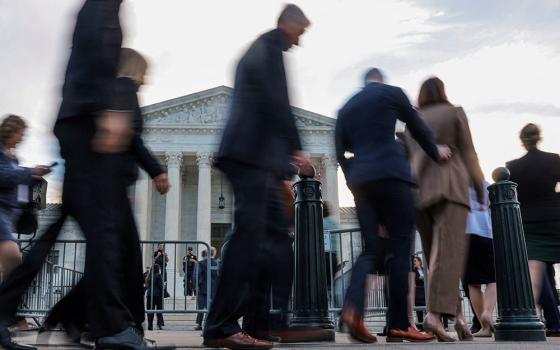 People walk in front of the U.S. Supreme Court building on the first day of the court's new term in Washington Oct. 5, 2026. (OSV News/Reuters/Jonathan Ernst)