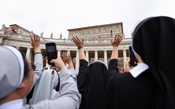 Faithful cheer as Pope Leo XIV appears in a window of the Apostolic Palace over St. Peter's Square in his first public event since his cancer surgery, at the Vatican, Oct. 18, 2026. (OSV News/Reuters/Matteo Minnella)