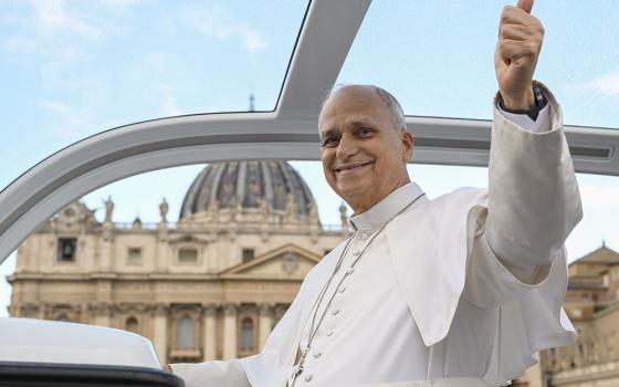 Pope Leo XIV gives the thumbs up as he arrives in his popemobile in St. Peter's Square at the Vatican, Oct. 21, 2026, to hold his first weekly general audience since cancer surgery on Oct. 13. (OSV News/Vatican Media/Simone Risoluti)