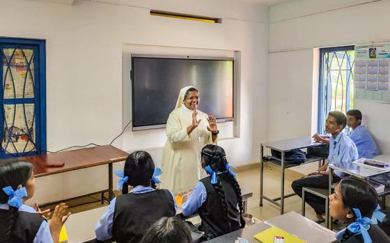 Sr. Alice Kasmel Vadakkethundil, member of the Daughters of Our Lady of Mercy, interacts with students at Karuna Speech and Hearing Higher Secondary School in Kozhikode, a town in the southwestern Indian state of Kerala. (George Kommattam)