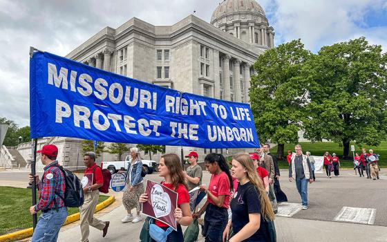 Participants in the Midwest March for Life walk past the Missouri Capitol in Jefferson City on May 1, 2025. (AP/David A. Lieb)
