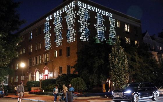 A message is projected on the side of a Cornell University building, Wednesday, Oct. 7, 2026, in Washington. (AP/Rahmat Gul)