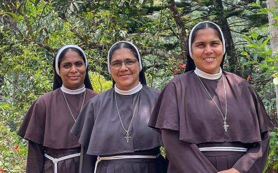 Srs. Ranit Pallassery, center, poses for a photo with her two supporters, Ancitta Urumbil, left, and Alphy Pallasseril, right. (Binu Alex)