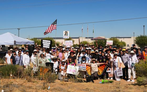 Activists pose for a photo after a prayer vigil outside an ICE detention center Oct. 7 in Adelanto, California. The vigil was held to pray for immigrants detained there and to draw attention to alleged inhumane conditions inside the facility. (Courtesy of Sisters of St. Joseph of Orange)