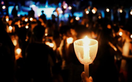 Candlelight vigil (Unsplash/Wendy Zhang)