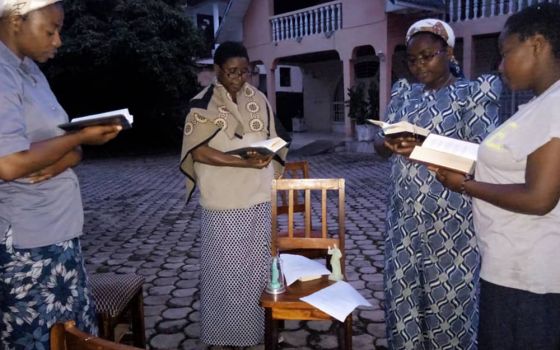 Ursuline Sisters pray outside of their house in the city of Goma, after a volcano eruption May 22 and subsequent earthquakes. The sisters pray outside to protect themselves against a possible collapse of their house. (Courtesy of Bernadette Mwavita/Ursuli