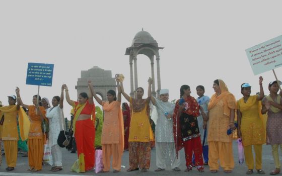 Women stand at India Gate in New Delhi, India, at the launch of a national campaign on the prevention of violence against women Oct. 2, 2009. (Wikimedia Commons/Ministry of Women and Child Development, Government of India)