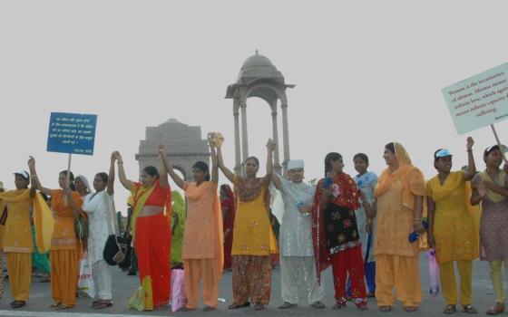 Women stand at India Gate in New Delhi, India, at the launch of a national campaign on the prevention of violence against women Oct. 2, 2009. (Wikimedia Commons/Ministry of Women and Child Development, Government of India)