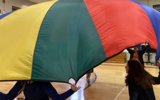 Students at Mount Mercy Academy in Buffalo, New York, play with a parachute. (Courtesy of Mike Hardy)