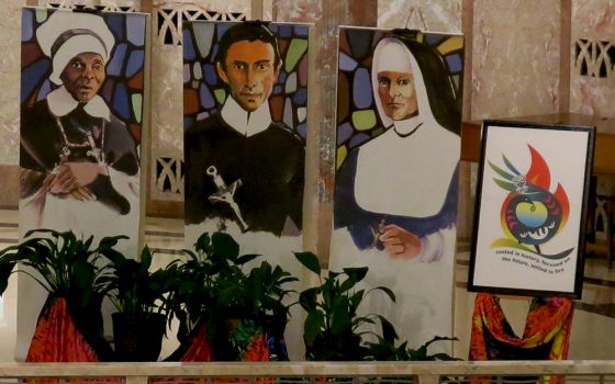 Banners portraying Mother Mary Lange, founder of the Oblate Sisters of Providence, Redemptorist Fr. Louis Gillet and Mother Theresa Maxis Duchemin, founders of the Sisters, Servants of the Immaculate Heart of Mary (IHM Communication Office of Monroe)