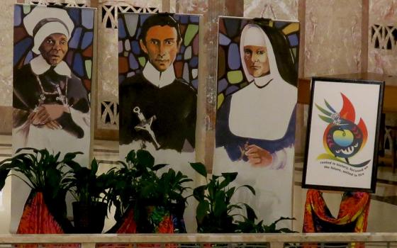 Banners portraying Mother Mary Lange, founder of the Oblate Sisters of Providence, Redemptorist Fr. Louis Gillet and Mother Theresa Maxis Duchemin, founders of the Sisters, Servants of the Immaculate Heart of Mary (IHM Communication Office of Monroe)