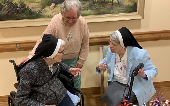 Sr. Benilda Nadolski, 99, left, the eldest of the Franciscan Sisters of St. Joseph and in the 79th year of her religious profession, converses with Sr. Marcia Ann Fiutko, center, and Sr. Alexine Machowicz, 89, at St. Francis Park this past spring. (Courte