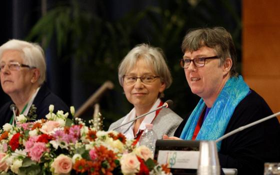 Sr. Mary Teresa Barron, right, superior general of the Sisters of Our Lady of Apostles, speaks May 3 at the UISG assembly in Rome with Loreto Sr. Patricia Murray, left, UISG executive secretary, and Claretian Sr. Jolanta Kafka. (CNS)