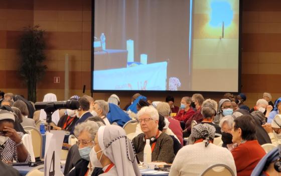 Women religious attending the 2022 plenary for the International Union of Superiors General pray for peace in Ukraine and for Vladimir Putin on May 6, the final day of the triennial plenary, in Rome. (GSR photo/Gail DeGeorge)