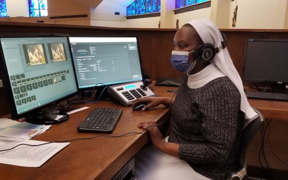Sr. Teresia Mutiso streams Mass to those unable attend due to the coronavirus pandemic at St. Thomas Aquinas Church in Binghamton, New York. (Provided photo)