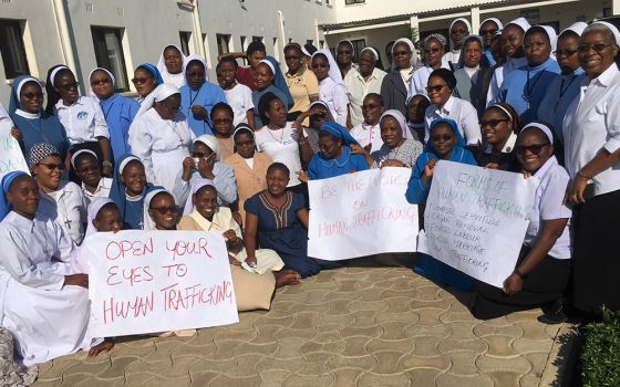 Sisters from across Zambia attended a workshop in November 2021 in Makeni, Lusaka, on advocacy against human trafficking. The sisters stand with the signs they made as part of their awareness-raising efforts. (Sr. Eucharia Madueke)