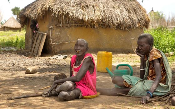 South Sudanese women sit outside their shelter in Genyiel county, Unity State, South Sudan, in this Sept. 24, 2020, file photo. Pope Francis had planned to visit Congo and South Sudan in early July, but that trip was canceled because of his health. 