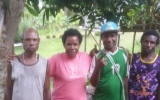 Imelda Suyai, a Sister of Presentation of the Blessed Virgin Mary, pictured with three of her four brothers, grew up in a rural village in Papua New Guinea. Her parents were subsistence farmers. (Courtesy of Sr. Imelda Suyai)
