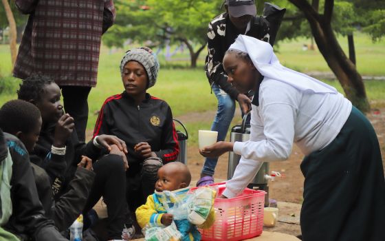 Sr. Caroline Ngatia of the Assumption of the Blessed Virgin Mary Sisters of Eldoret shares breakfast with the street families in Nairobi, Kenya. (Doreen Ajiambo)