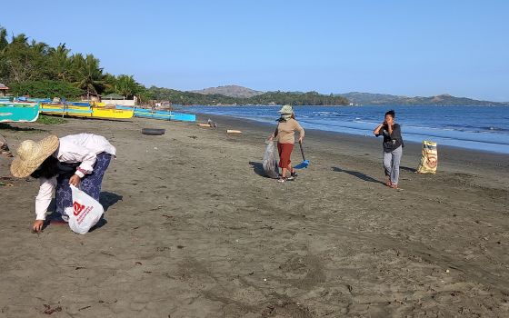 Missionary Sisters of St. Columban in the Philippines organized a beach cleanup as part of a project to educate people about caring for the environment. (Courtesy of Cristita de Leon)