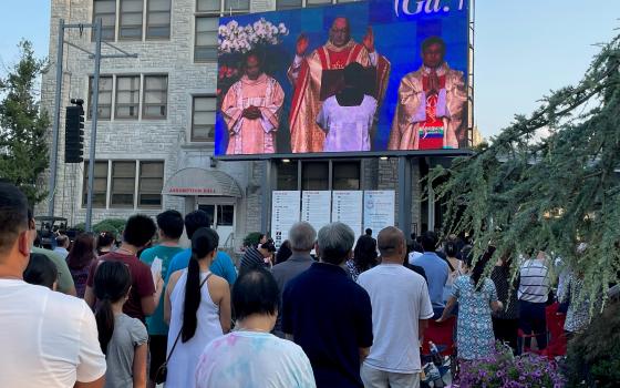 Marian Days participants watch Bishop Edward Rice of the Diocese of Springfield-Cape Girardeau celebrate the opening Mass of the festival in Carthage, Missouri, Aug. 4. (Peter Tran)