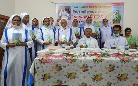 Sr. Mary Proshanta of the Associates of Mary Queen of the Apostles and guests celebrate the Sept. 17 release of Proshanta's book, "Go to Saint Joseph." It is the first book on St. Joseph to be written in Bangla. (Sumon Corraya)