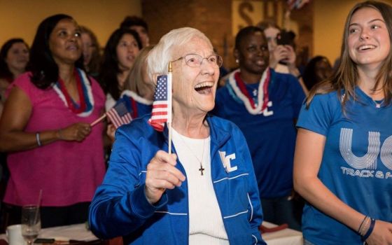 Mercy Sr. Percylee Hart cheers on Union Catholic Regional High School alumna Sydney McLaughlin on Aug. 3 as she competes in the 2020 Olympics. McLaughlin won a gold medal in the women's 400-meter hurdles event that day. (Courtesy of Jim Lambert)