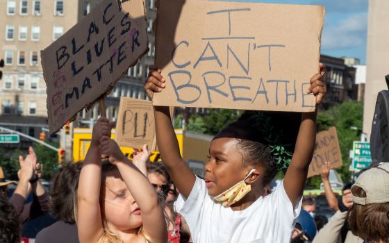 Children hold signs saying "Black Lives Matter" and "I Can't Breath" at a demonstration in Prospect Park, Brooklyn, New York, June 7. (Wikimedia Commons/Rhododendrites)