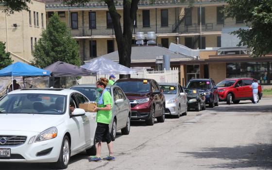 Staff and volunteers fill drive-through orders at the 2020 School Sisters of St. Francis' Sister Water Beer Garden in a Box fundraiser. (Courtesy of the School Sisters of St. Francis)