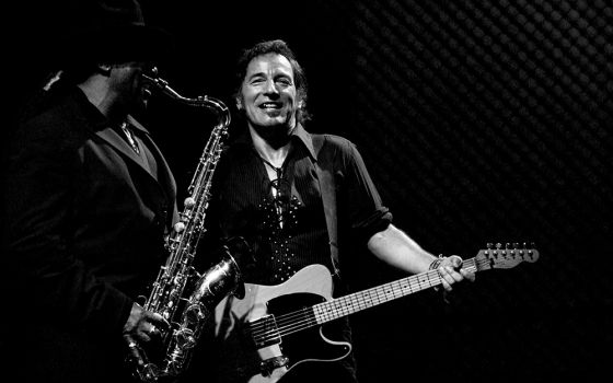 Bruce Springsteen performs with E Street Band member Clarence Clemons, left, during "The Rising" tour in 2003. (Dreamstime/Fabio Diena)