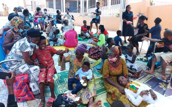 Sr. Olivia Umoh, a member of the Daughters of Charity of St. Vincent de Paul, speaks with parents and children with disabilities Oct. 13 in a Catholic-run facility courtyard next to St. Peter Cathedral in Kumasi, Ghana. (CNS/Courtesy of SCP)
