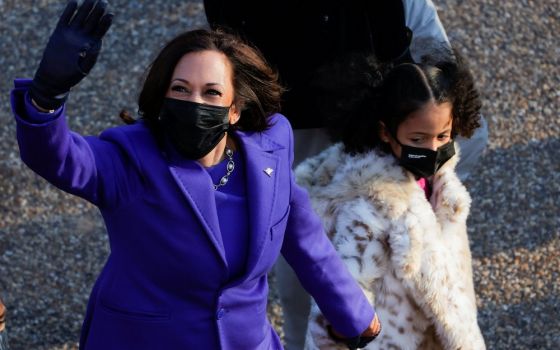 Vice President Kamala Harris walks with her great-niece Amara Ajagu to the White House in Washington Jan. 20, 2021, during the Inauguration Day parade. (CNS/Reuters/Andrew Kelly)