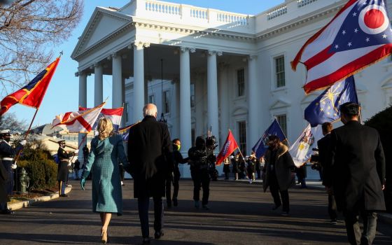 President Joe Biden and first lady Jill Biden walk to the White House in Washington Jan. 20, 2021. (CNS/Reuters/Tom Brenner)