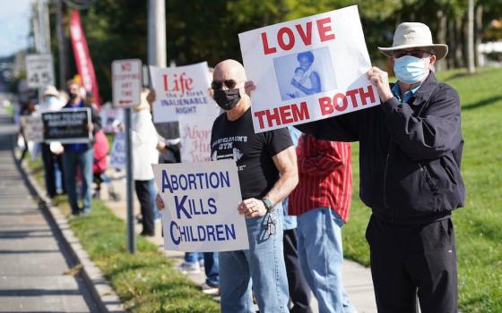 Pro-life advocates mark Respect Life Sunday by participating in the 23rd annual “Stand Up for Life” roadside vigil Oct. 4 in Manorville, New York. (CNS/Gregory A. Shemitz)