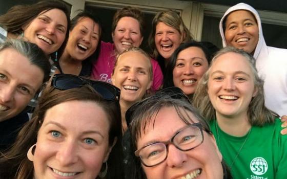 Sr. Colleen Gibson, right, in green, with other Sisters of St. Joseph.