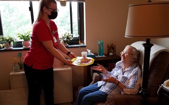 Caldwell University nursing student Elizabeth Ann McChesney visits with Dominican Sr. Rita Calabrese at the St. Catherine of Siena Convent in Caldwell, New Jersey. (Courtesy of Caldwell University)