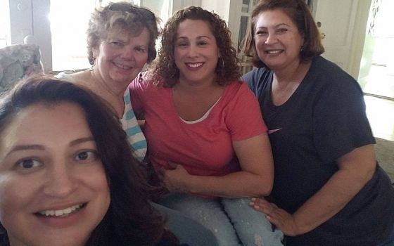 Sr. Darlene Kawulok of the Sisters of St. Joseph of Carondelet, Los Angeles Province, (second from left) takes a picture with women living at Medaille House in July 2019. Medaille House, founded in 2013 by the St. Joseph sisters, started offering virtual 
