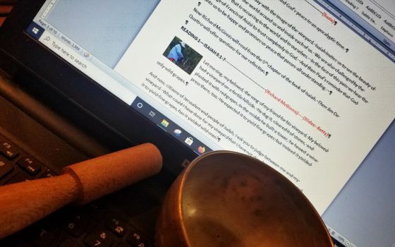 The script for speakers and those with musical roles at Solidarity with Sisters' Oct. 4 gathering, with the singing bowl the group uses to end silences (Betty D. Thompson)